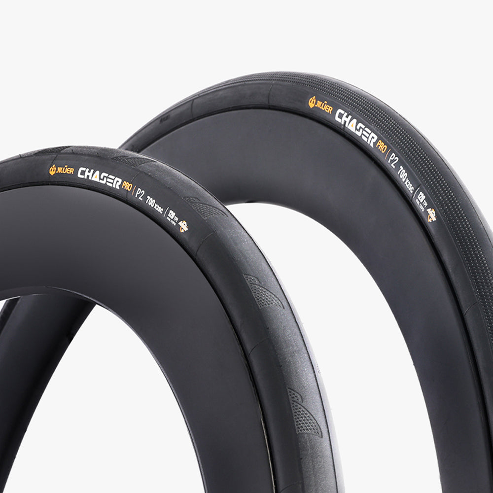 Two black bicycle tires with 'Chaser' branding on a white background
