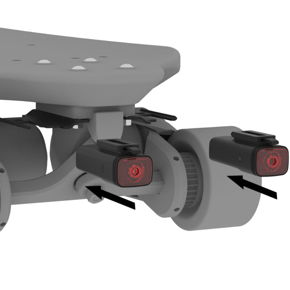 Close-up of a scooter's rear with red lights on a white background