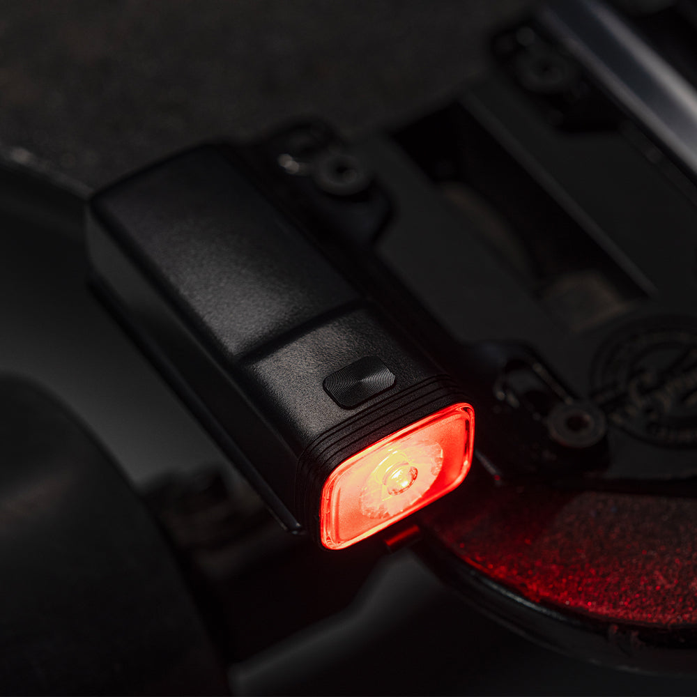 Red LED light on a Longboard, close-up view