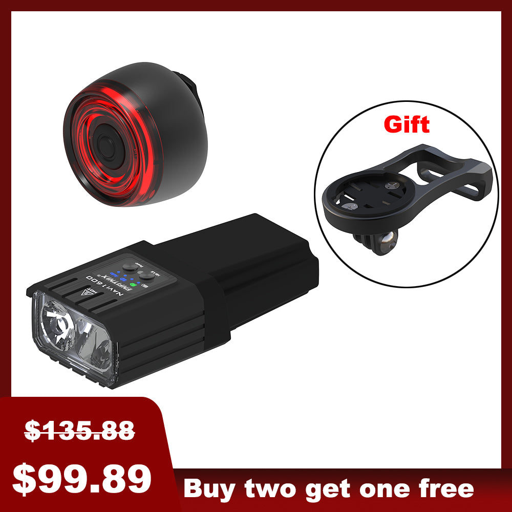 The image shows a set of bike lights with the front light prominently displayed alongside a red tail light in the background. The front light has a black rectangular housing with a white light module, and there's a 'Gift' badge indicated in the top right corner.