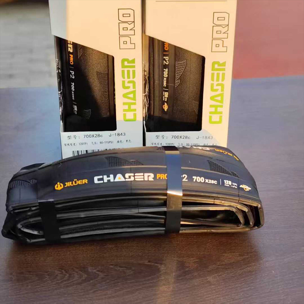 Bicycle inner tubes with 'Chaser Pro' branding on a wooden surface