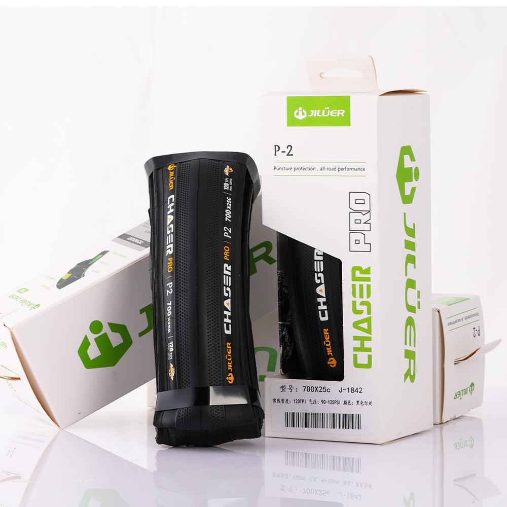 Black bicycle tire with 'Jiluier Chaser Pro' branding on a white background