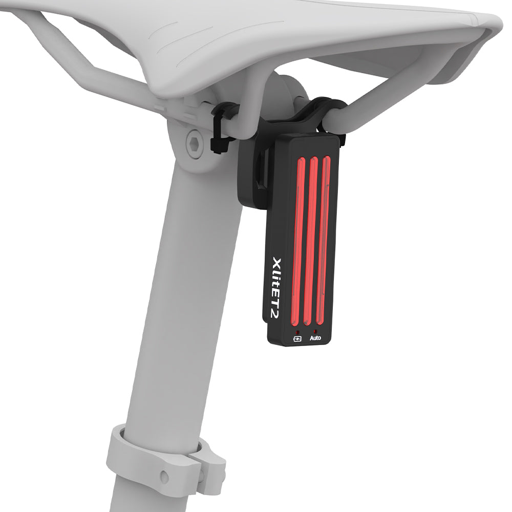 Black and red device attached to a white chair with 'Xiaomi' branding.