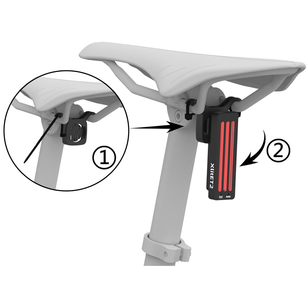 Close-up of a bike seat with a light attachment labeled 'XlitET2'.