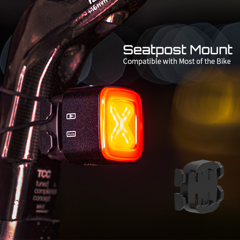 Bicycle light with seatpost mount on a dark background
