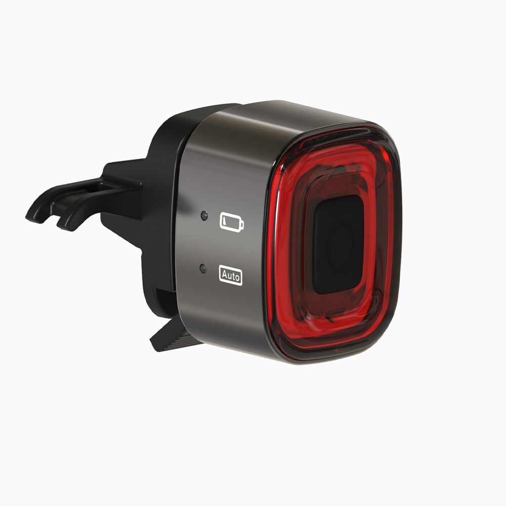 Black and red car air freshener with visible brand logo on a white background