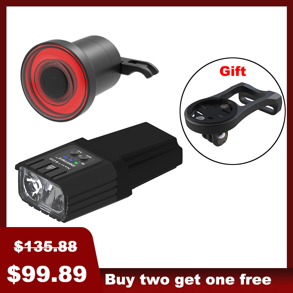 The image shows a set of bike lights with the front light prominently displayed alongside a red tail light in the background. The front light has a black rectangular housing with a white light module, and there's a 'Gift' badge indicated in the top right corner.