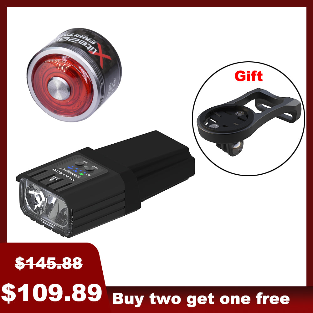 The image shows a set of bike lights with the front light prominently displayed alongside a red tail light in the background. The front light has a black rectangular housing with a white light module, and there's a 'Gift' badge indicated in the top right corner.
