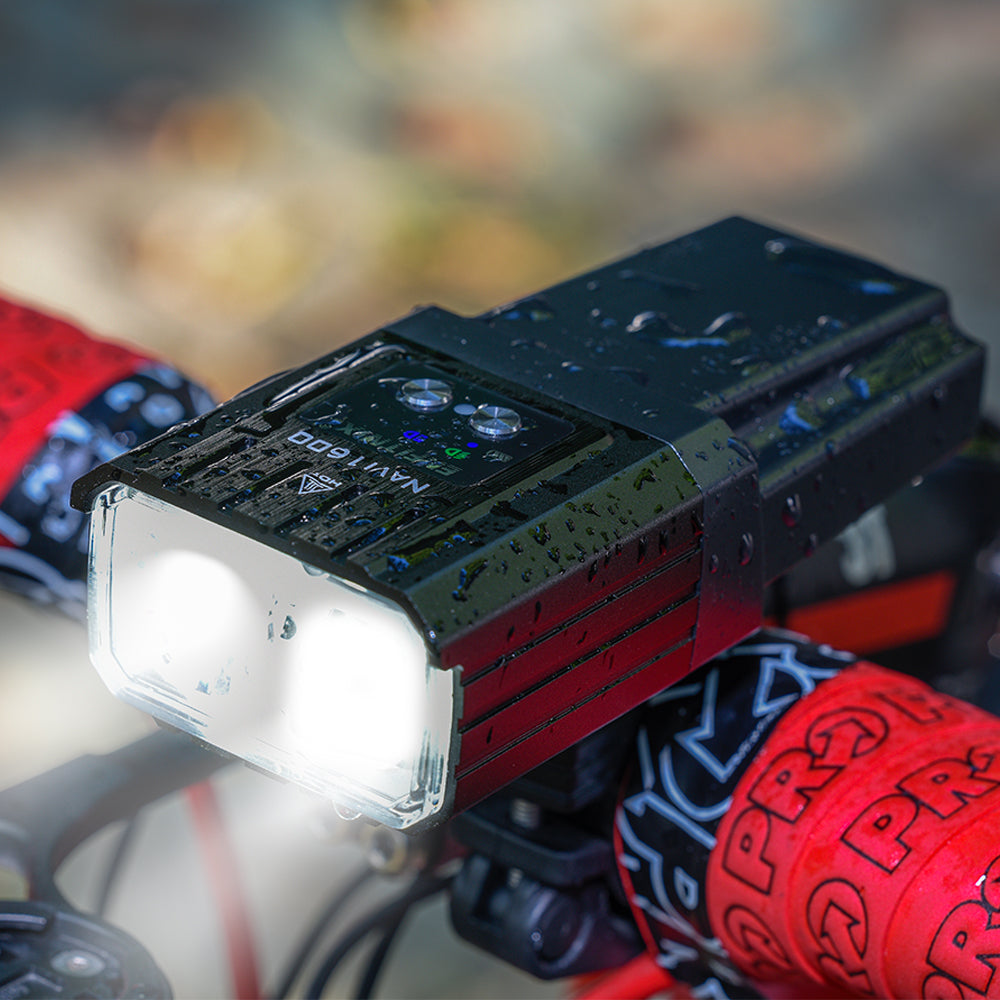 Close-up of a small electronic device with a light on a blurred background