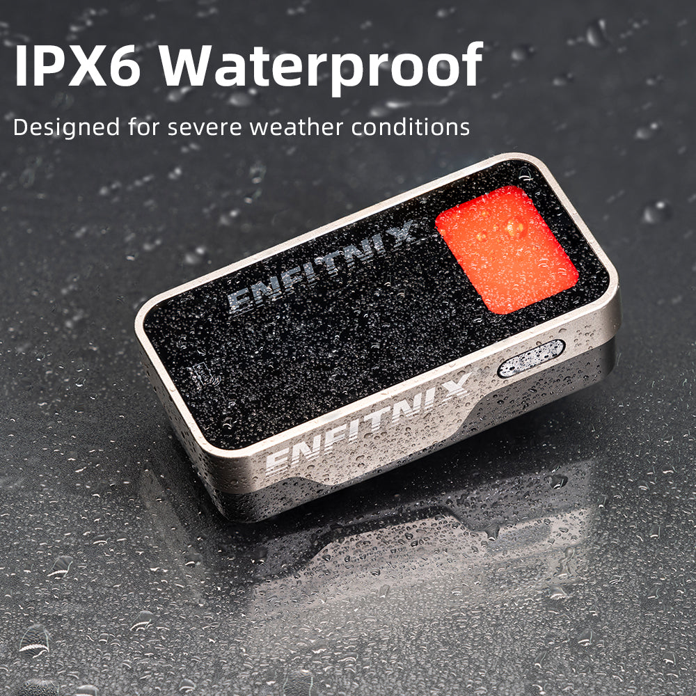Small rectangular device with red button and 'ENFITNIX' branding on a wet surface, labeled IPX6 Waterproof.