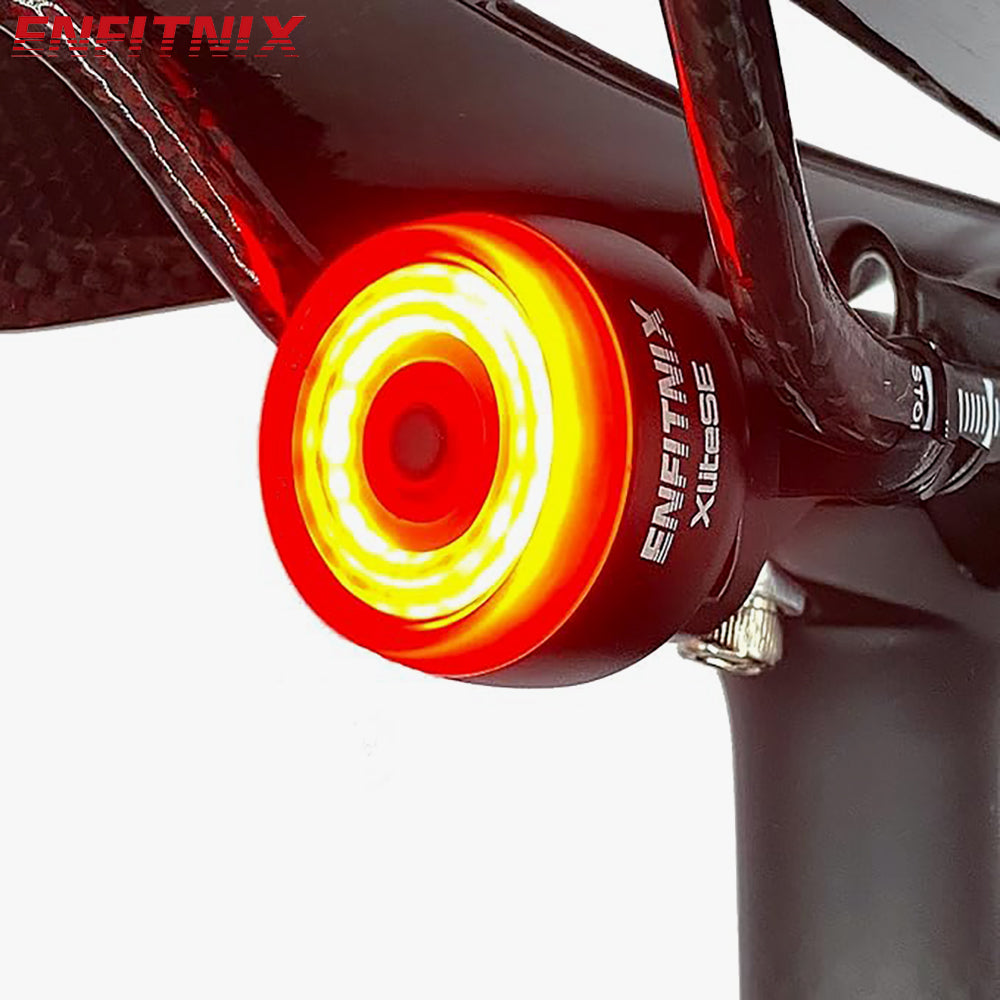 An XliteSE bicycle taillight is installed behind the bicycle saddle and emits a bright red light.