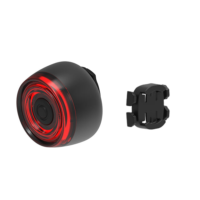 Black and red bike light with mounting bracket on a white background