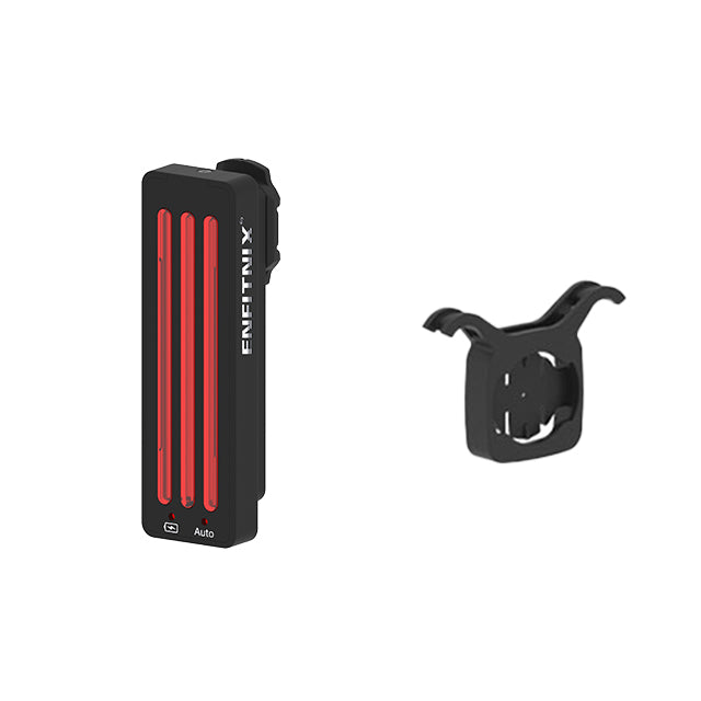 Black and red light device with a mounting bracket on a white background