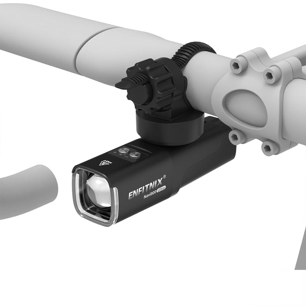 Black bike light attached to a bicycle handlebar on a white background