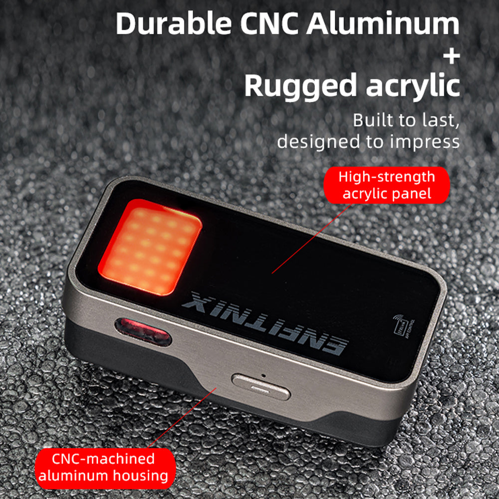 Small electronic device with CNC-machined aluminum housing on a textured surface