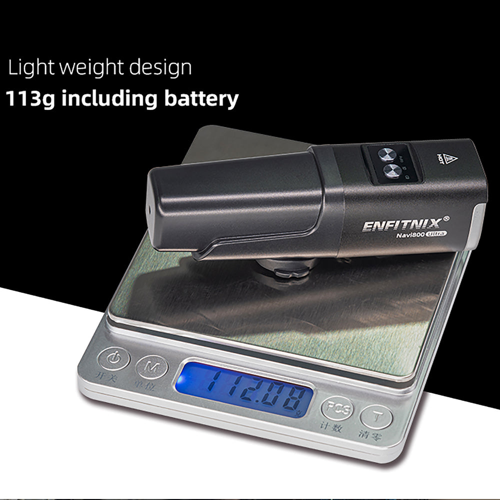 Digital scale with a small device on top, displaying weight, against a black background.