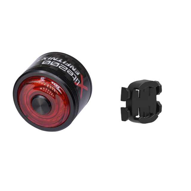 Red bicycle tail light with black mount on a white background