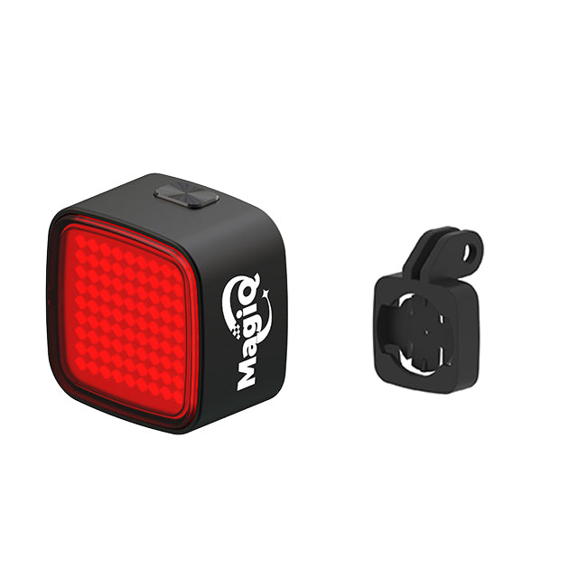 Black and red bike light with a mounting bracket on a white background