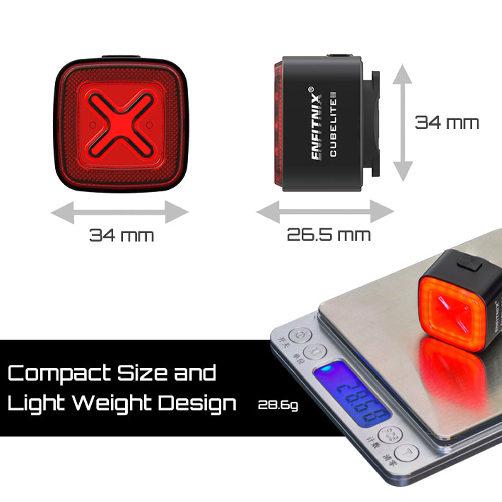 Enfitnix CubeLight bicycle light with dimensions and weight displayed on a scale.