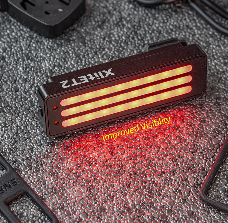 LED light with 'Xlight' branding on a textured surface