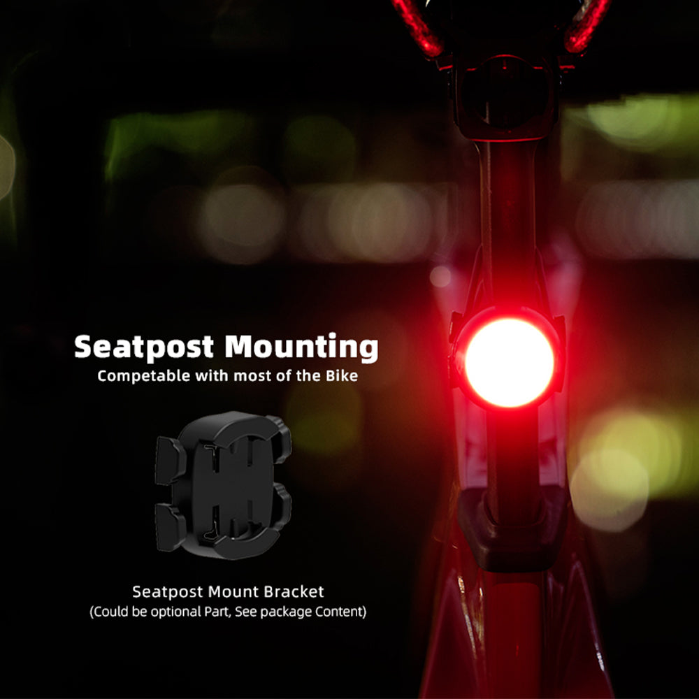 Bicycle light with seatpost mounting bracket on a dark background
